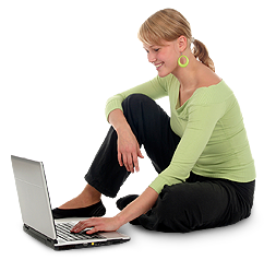 Woman using computer on the ground